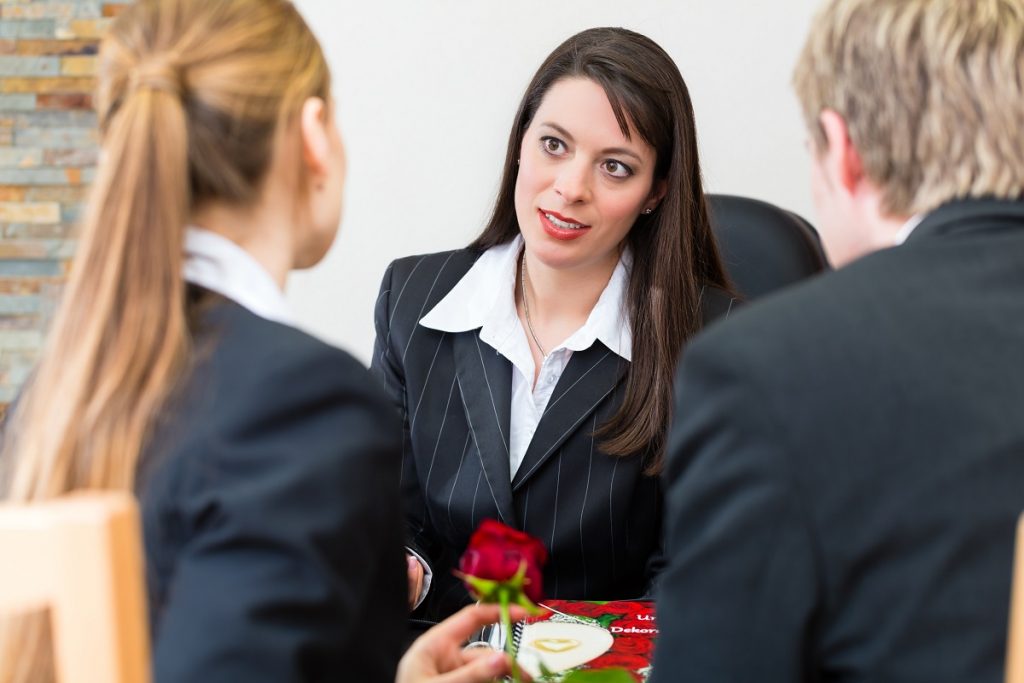 Woman consulting agent for a funeral plan