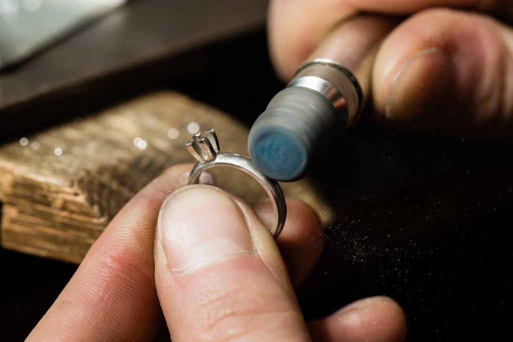Jeweler repairing a ring
