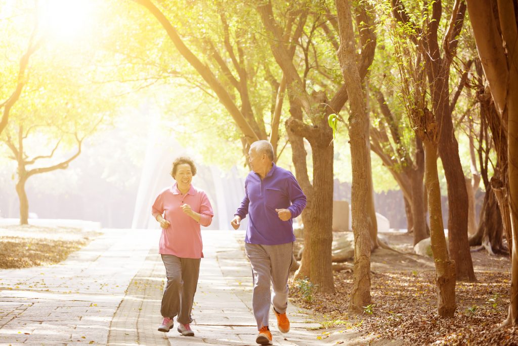 old couple jogging in the morning