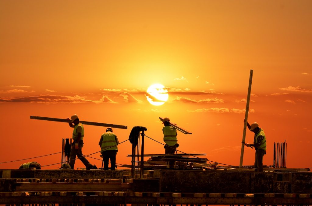 Men working during the sunset