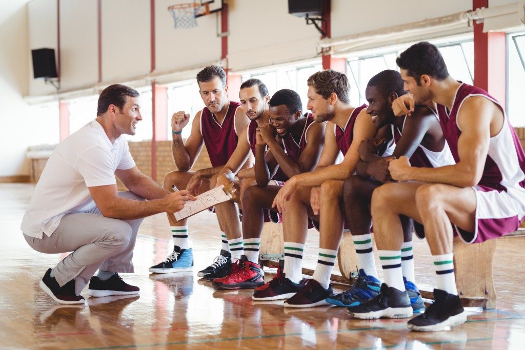 basketball team and coach