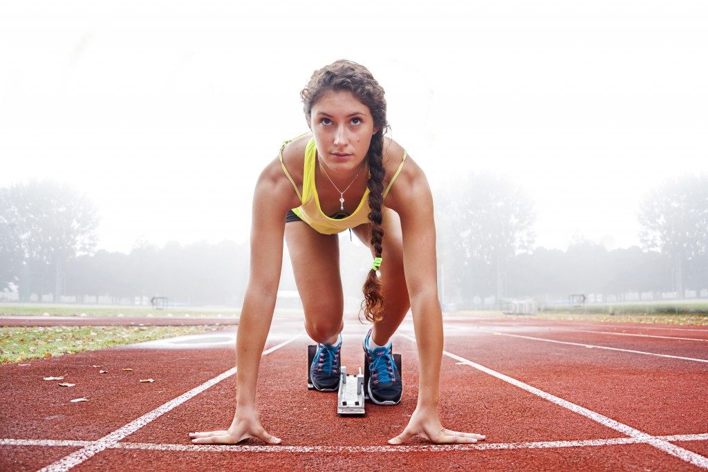 Athlete woman at the track field