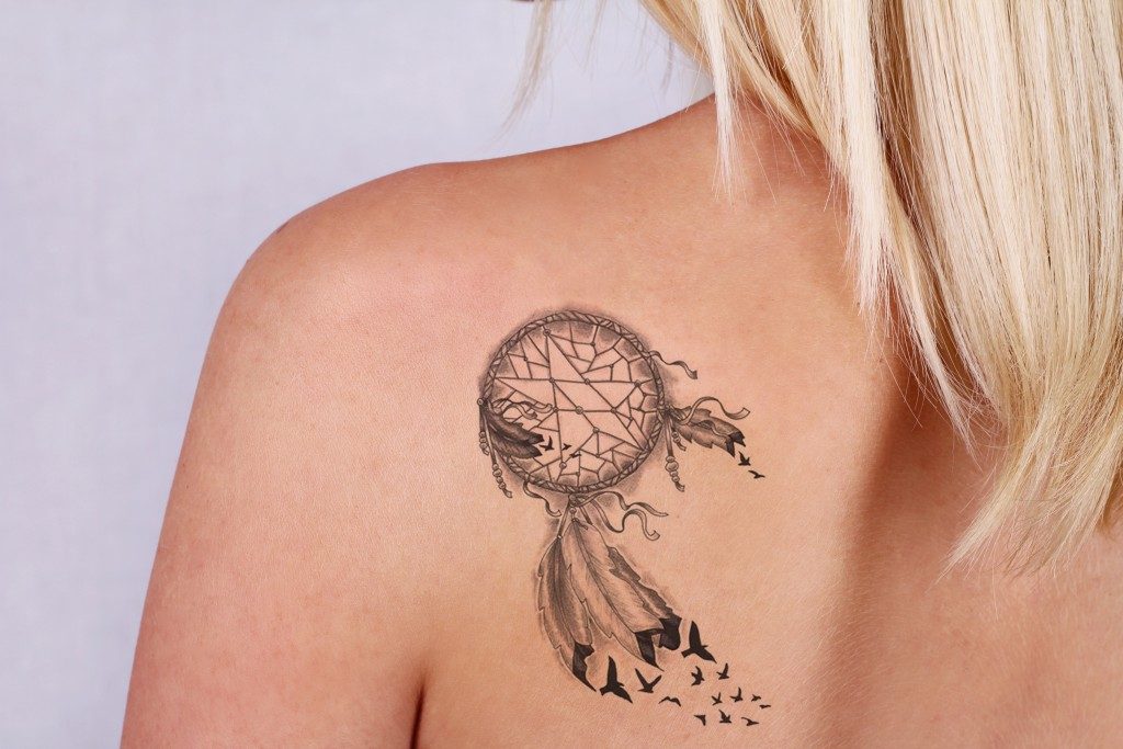Woman with tattoo on her back