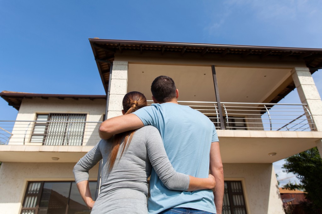 Couple looking at their first home