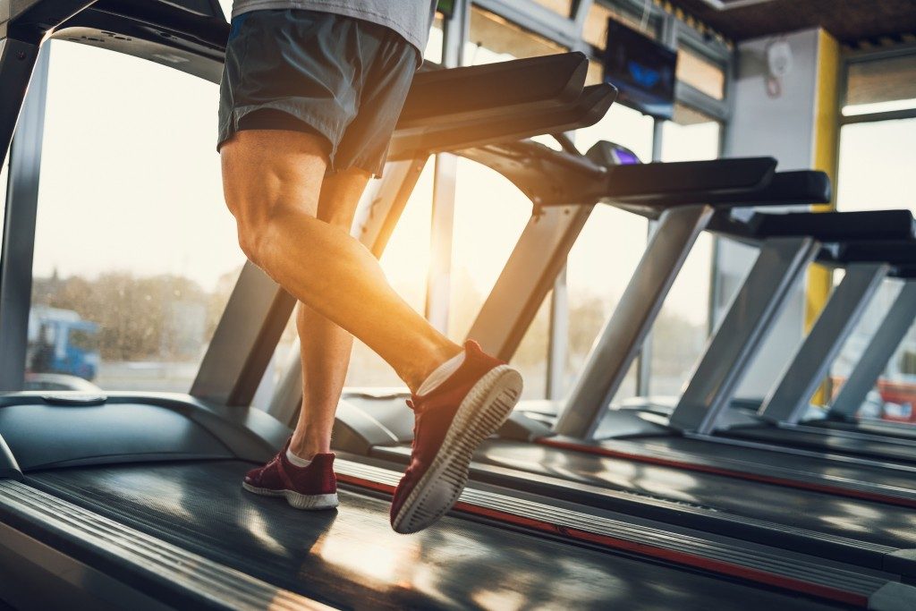 man running on an inclined treadmill