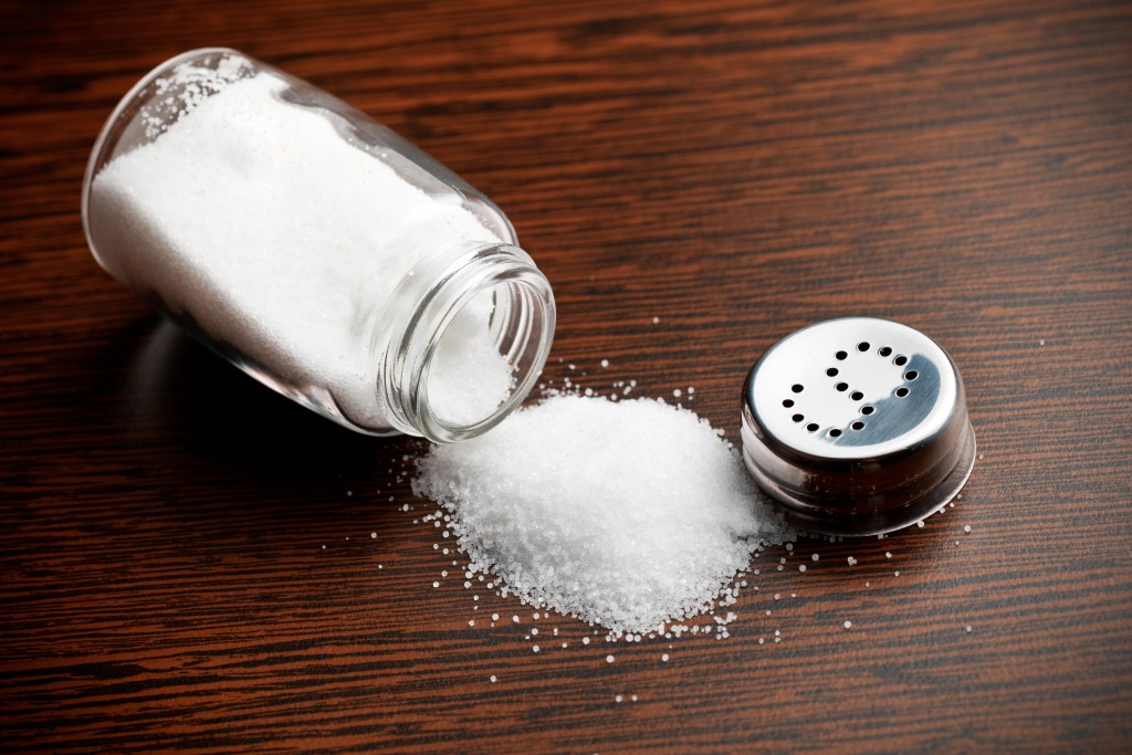 salt sprinkled on wooden table