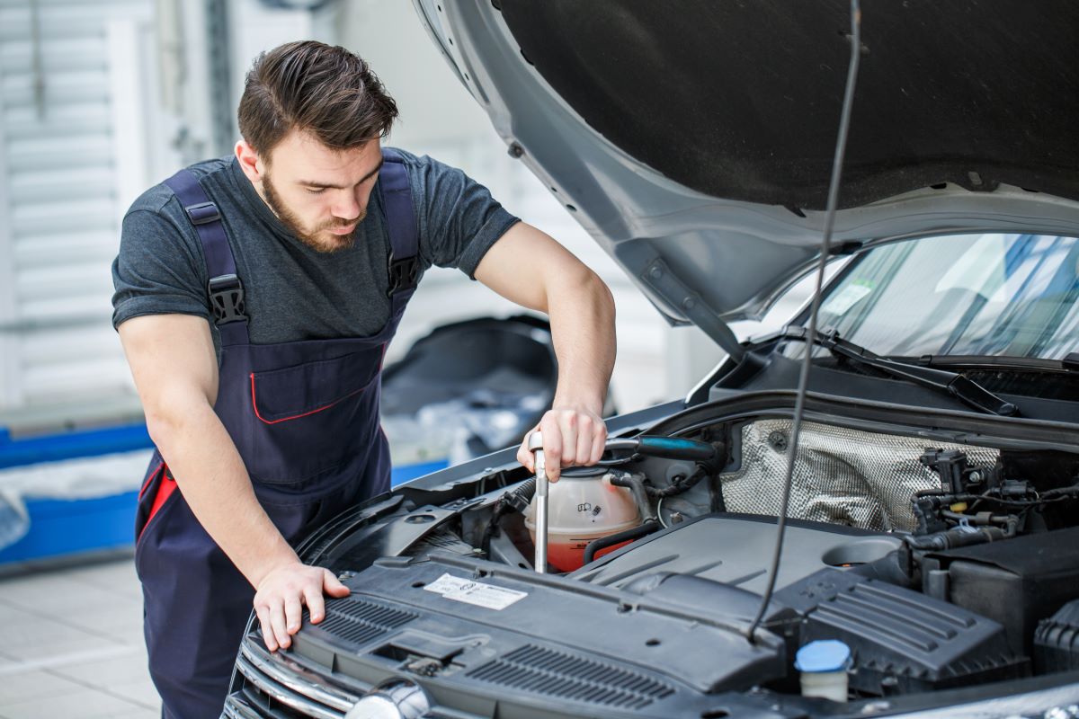 man working on car