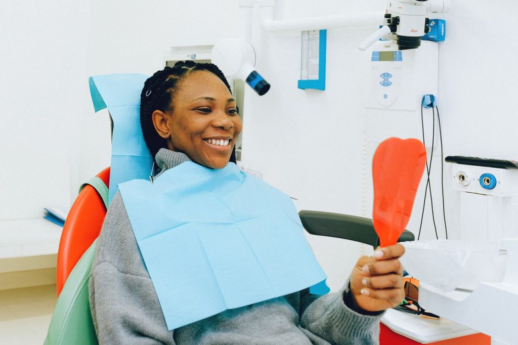 woman smiling at the dentists