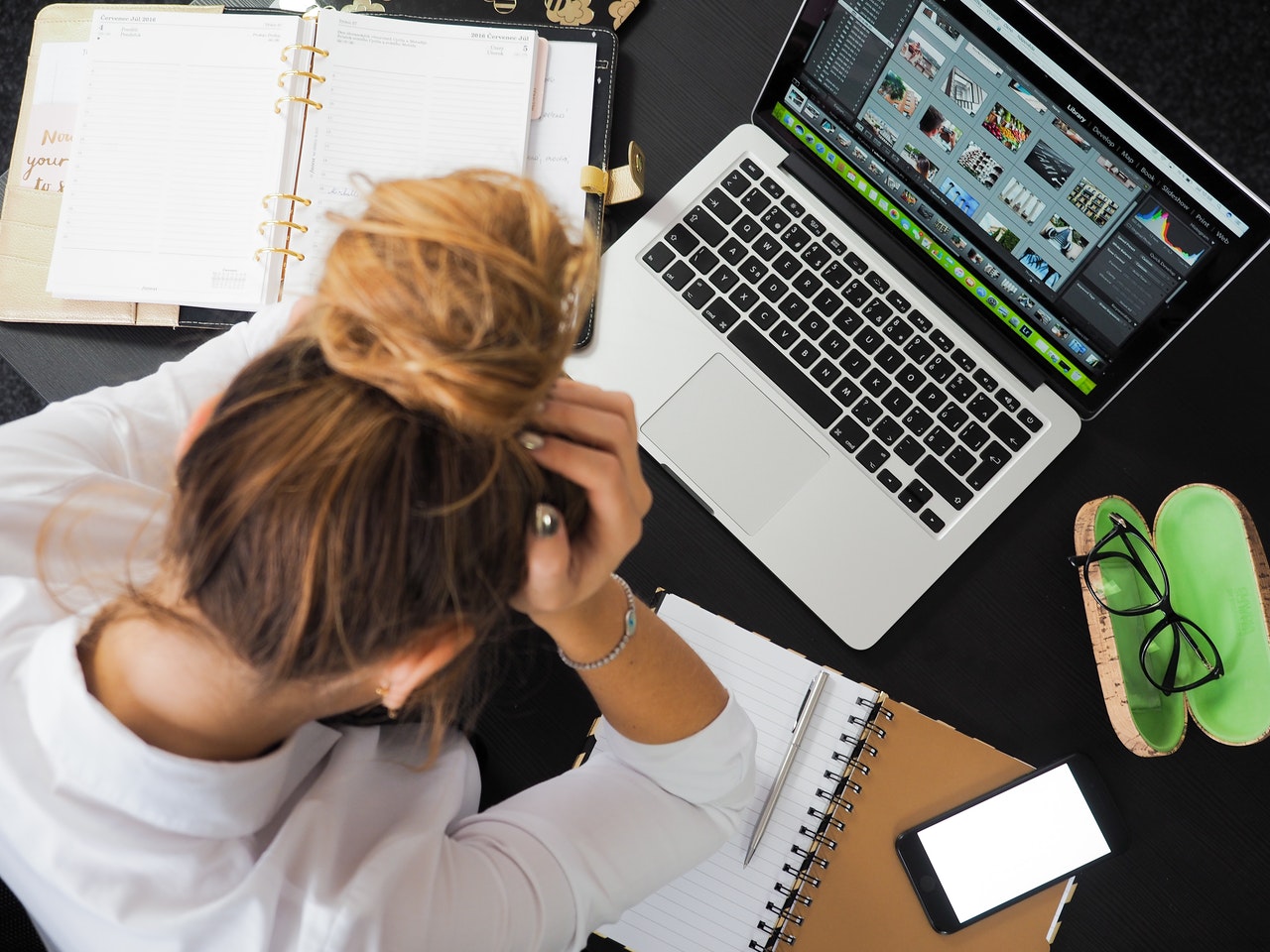 stressed woman in front of a laptop