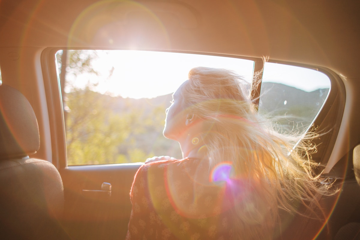 looking out the window of a car