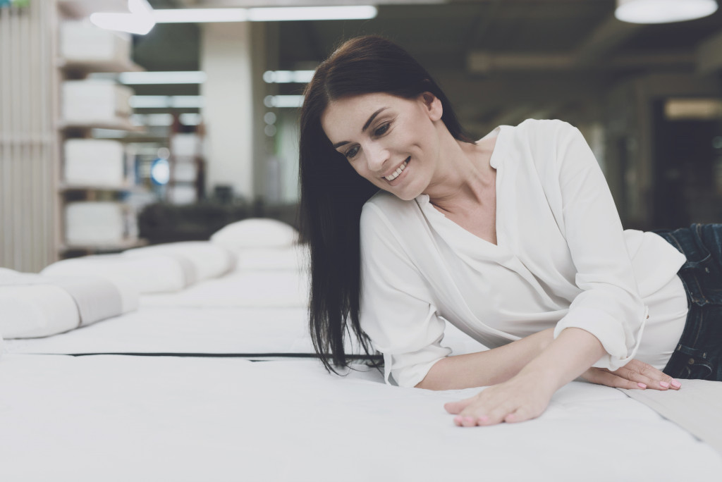 woman checking bedding