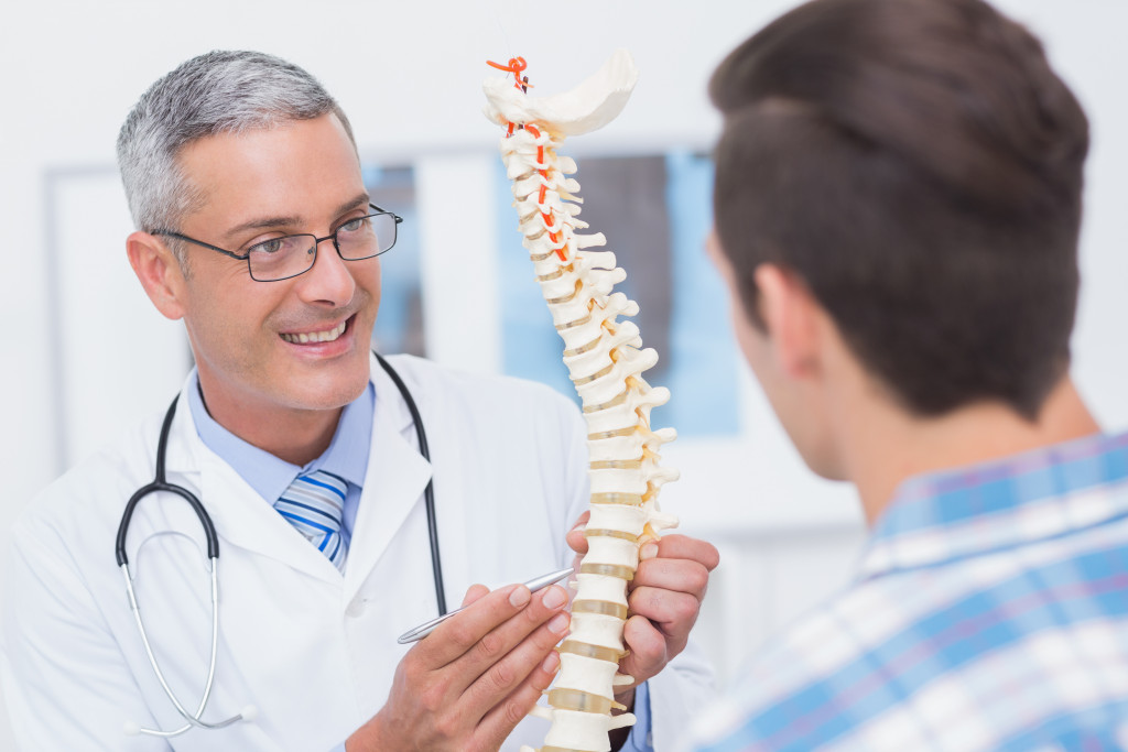 The human spine being explained to a patient