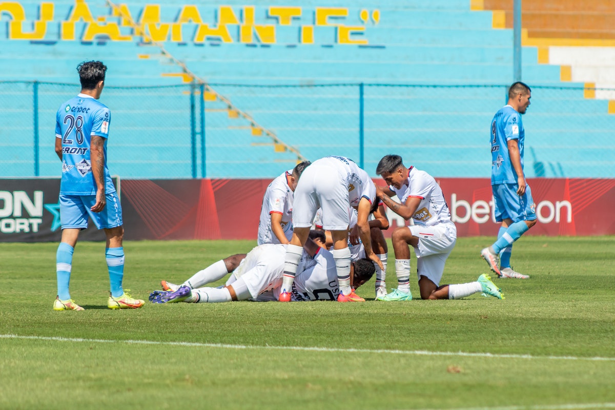 Athletes on Football Pitch Field