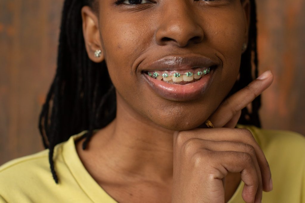Smiling black woman with teeth braces