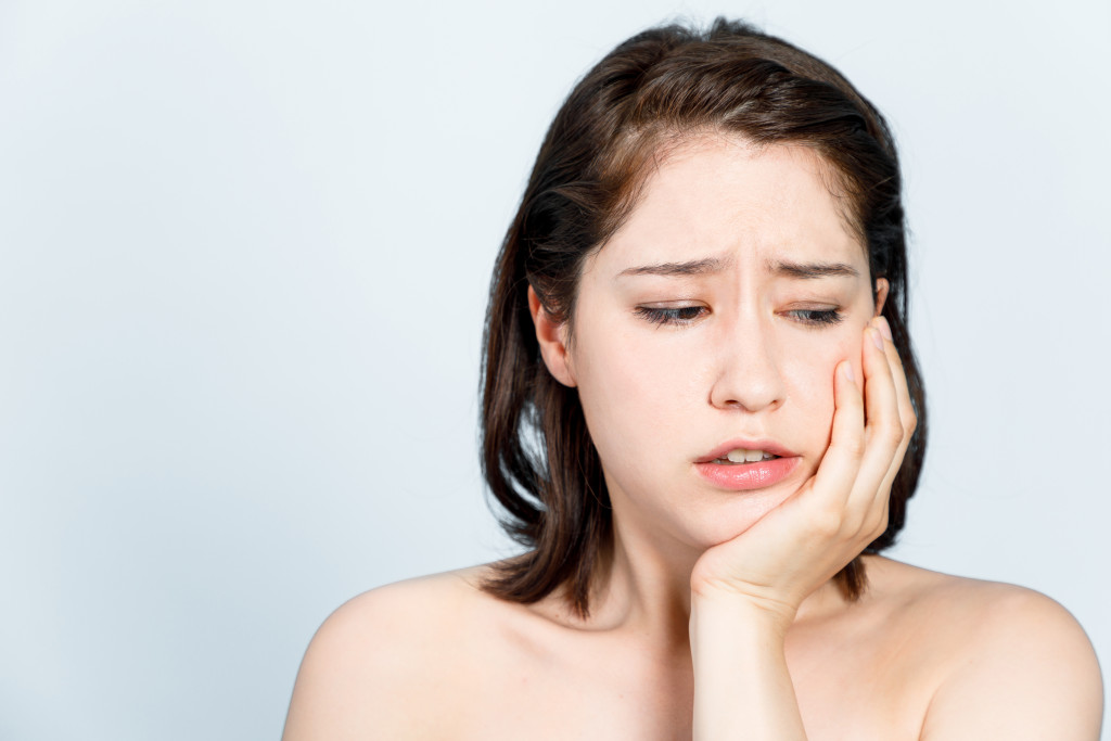 girl getting toothache concept of wisdom tooth