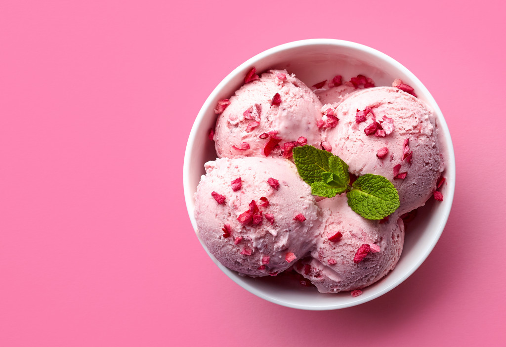 Strawberry ice cream in pink background