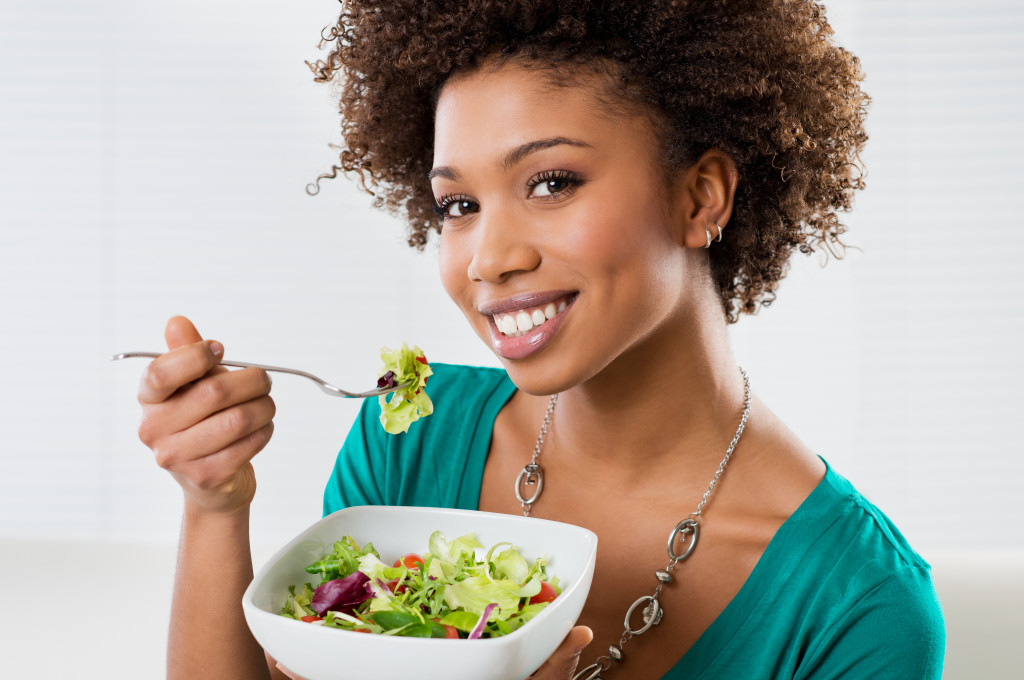 a woman Eating a Salad