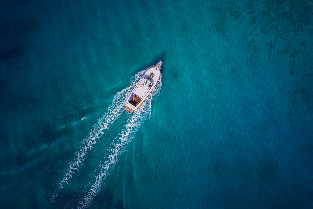 motor boat speeding in the middle of blue waters