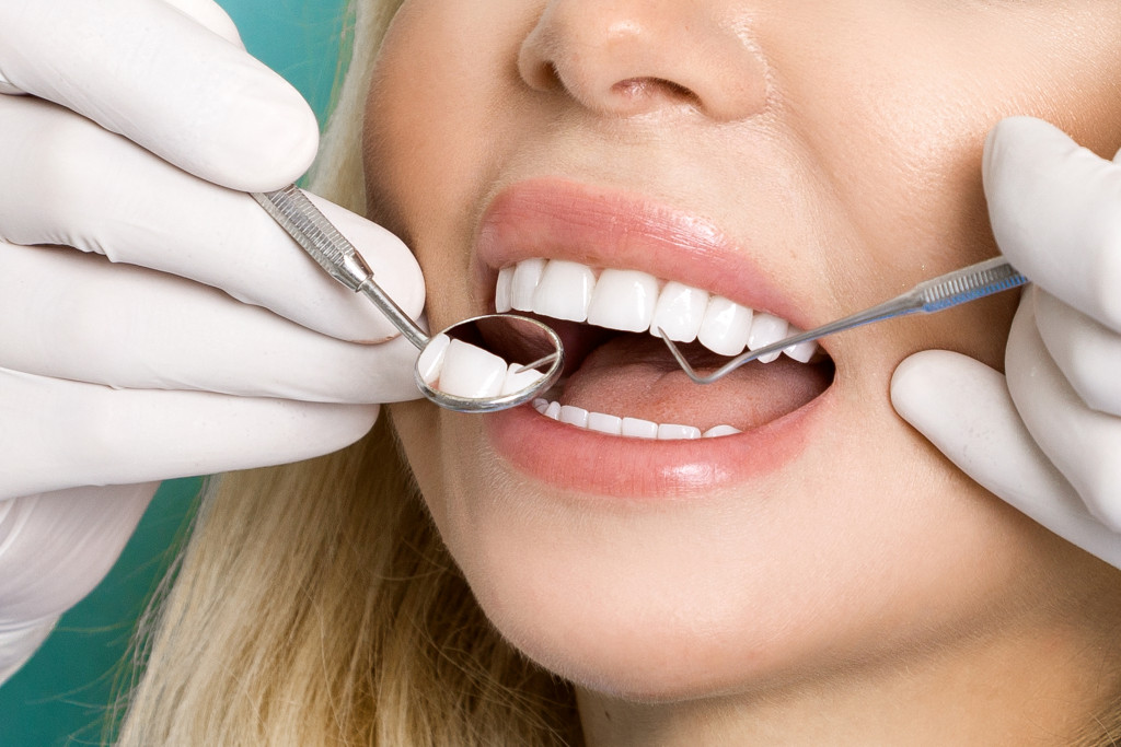 a patient teeth getting dental treatment 