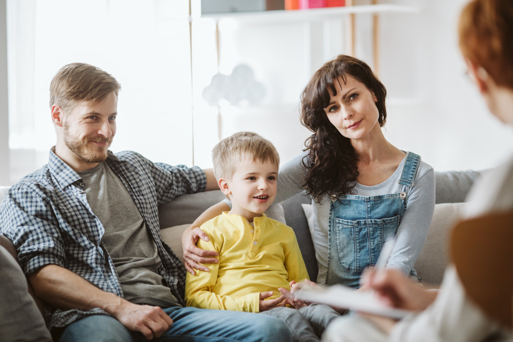 family talking to a therapist in her office