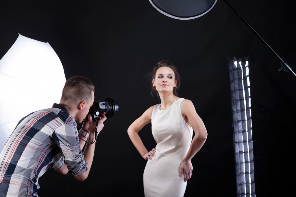 professional photographer taking photo of model or fashionista