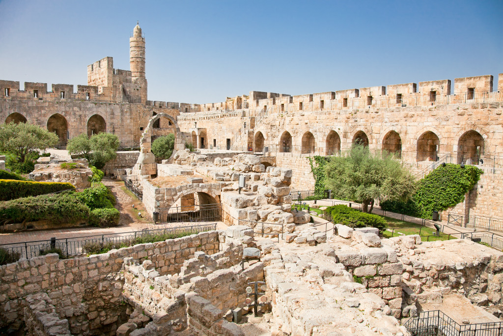 historial ruins with columns and castle in the distance