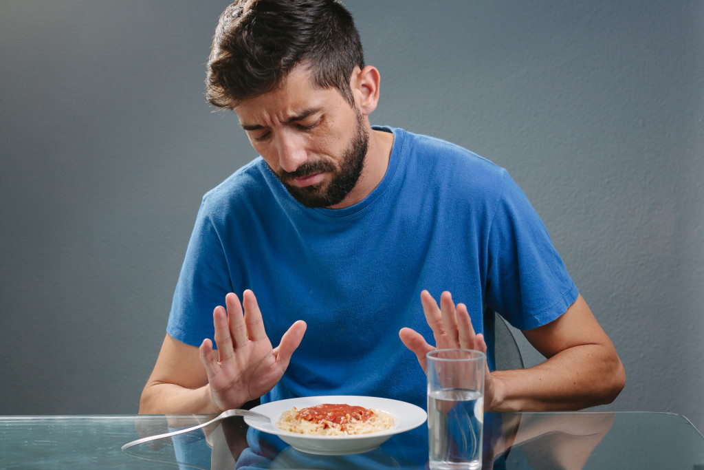 man not interested with food