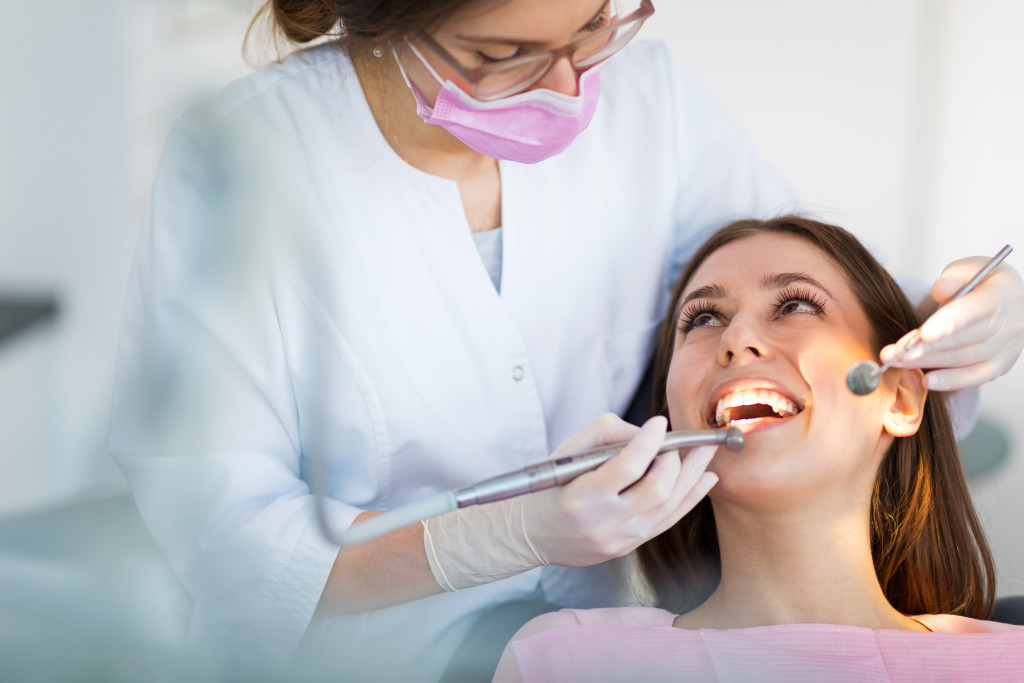woman getting check up on her teeth