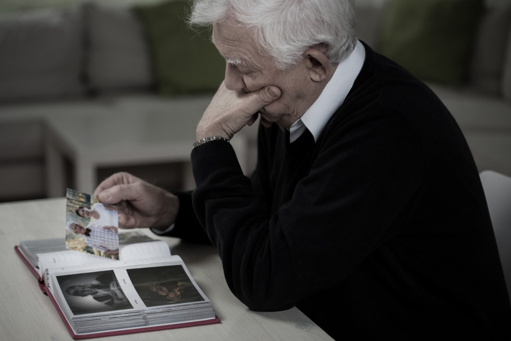 Senior looking at pictures of family