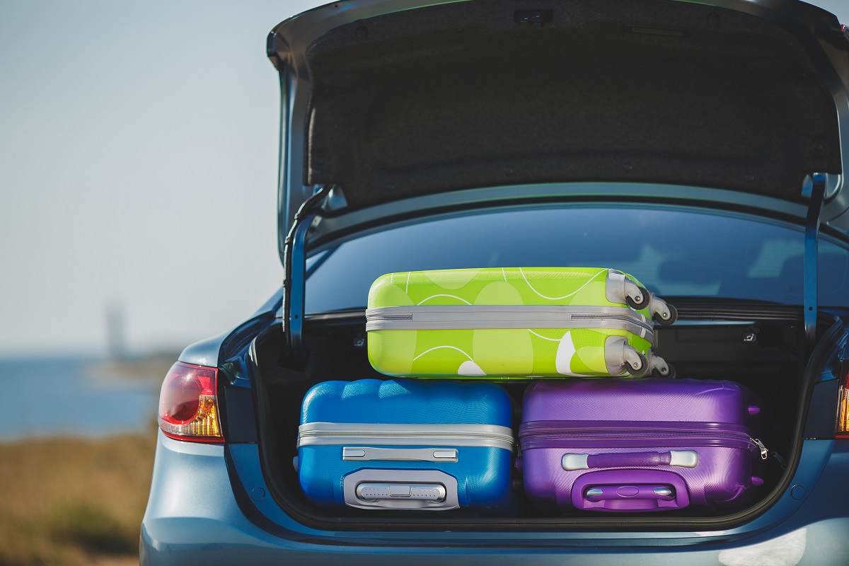 Three luggage in the car trunk